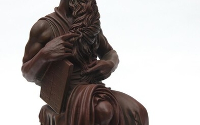 A BRONZE FINISHED BISQUE FIGURE DEPICTING MICHAELANGELO'S MOSES