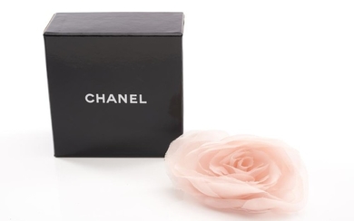 A BROOCH BY CHANEL