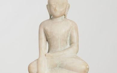 A Burmese carved marble figure of a seated Buddha