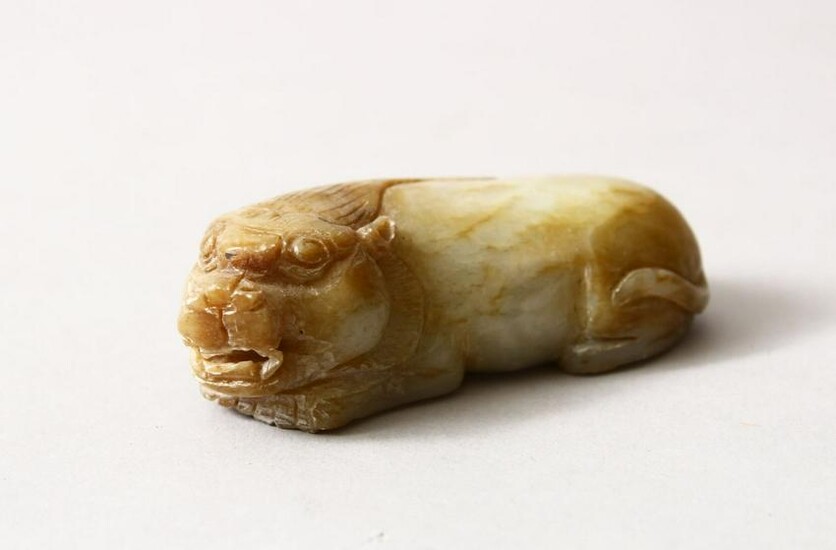 A CHINESE CARVED JADE / HARD STONE FIGURE OF A