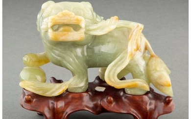 A Chinese Carved Celadon Jade Lion with Fitted W