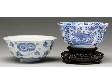 A Chinese blue and white fluted bowl, 18th c, painted to the...