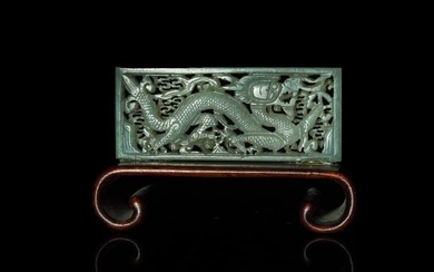 A Chinese carved white jade belt plaque, Ming dynasty