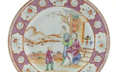 A Chinese famille rose plate depicting figures on a