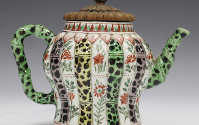 A Chinese famille verte porcelain teapot, Kangxi period, with carved wood cover, the baluster body m