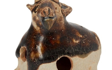 A Chinese pottery whistle in the form of a goat,...