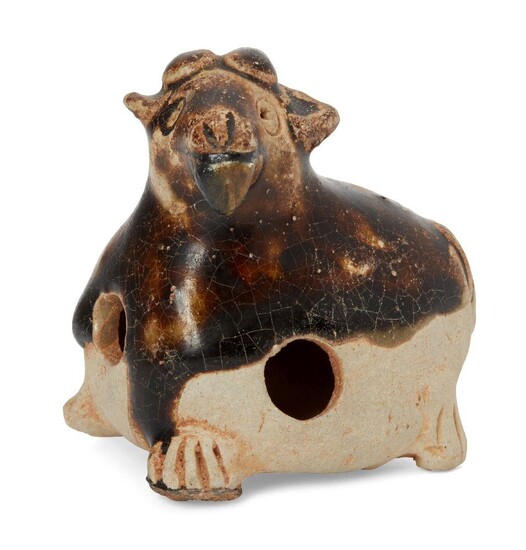 A Chinese pottery whistle in the form of a goat,...