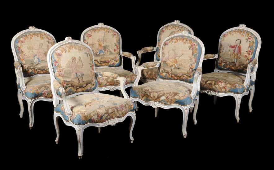 A French carved white-painted salon suite in Louis XV style