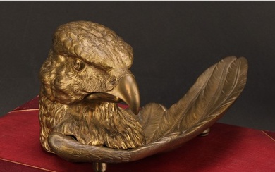 A French gilt metal novelty inkwell, cast as the head of an ...