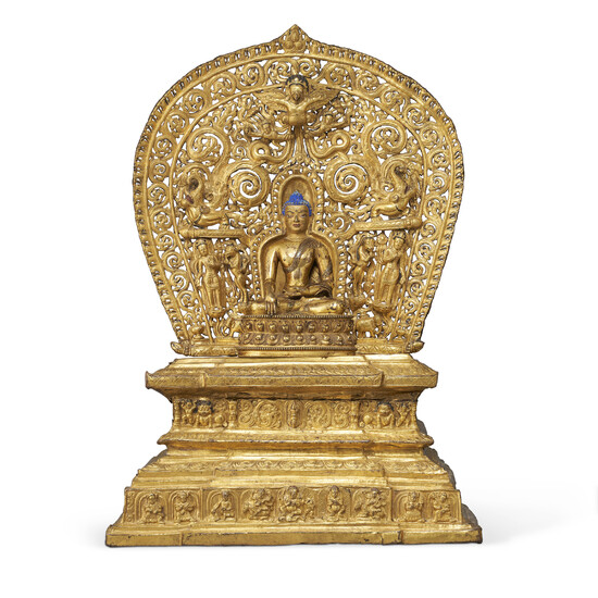 A GILT-BRONZE REPOUSSÉ THRONE AND AUREOLE WITH A GILT-BRONZE FIGURE OF BUDDHA TIBET, 14TH-15TH CENTURY