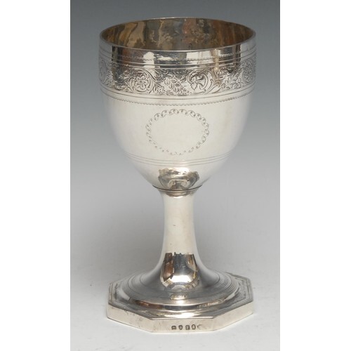 A George III silver pedestal goblet, bright-cut engraved wit...