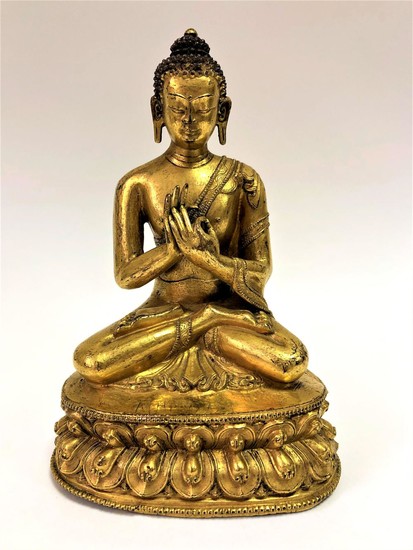 A Gilt Bronze Figure of Vairocana, Tibet, 16th Century.