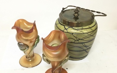 A Loetz style glass biscuit barrel and a pair of vases no ob...
