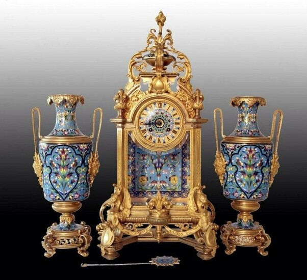 A MAGNIFICENT FRENCH CHAMPLEVE ENAMEL CLOCK SET