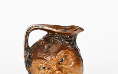 A Martin Brothers stoneware face jug by Robert Wallace Martin