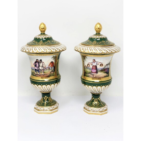 A PAIR OF CONTINENTAL PORCELAIN VASES AND COVERS