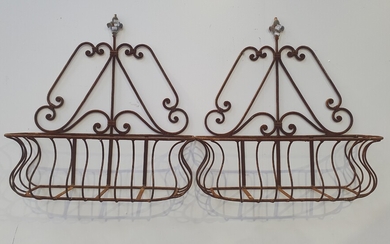 A PAIR OF WROUGHT IRON HANGING PLANTER BOXES