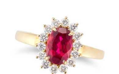A RUBELLITE TOURMALINE AND DIAMOND CLUSTER RING set with an oval cut rubellite tourmaline of 1.23
