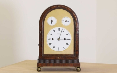 A Regency brass inlaid rosewood mantel clock