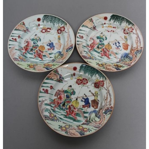 A SET OF THREE CHINESE PORCELAIN FAMILLE ROSE PLATES painted...