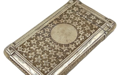 A SILVER CARD CASE WITH FLOWER DECORATION TO THE...