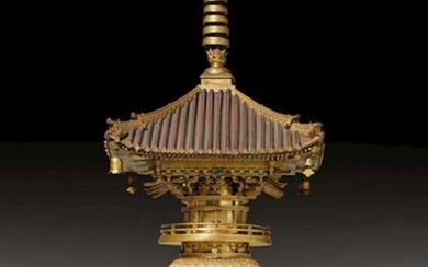A VERY RARE BUDDHIST RELIQUARY IN THE SHAPE OF A PAGODA.
