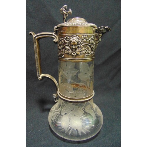 A Victorian hallmarked silver and glass claret jug, the body...