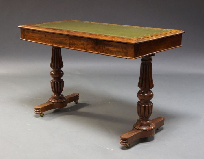 A Victorian mahogany library desk, the rounded...