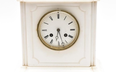 A WHITE MARBLE MANTLE CLOCK