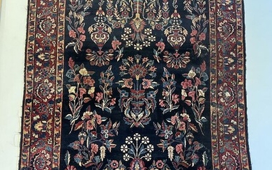 A Yazd rug, Persia. Flowers on a blue field. C. 1930–1940. 141×226...