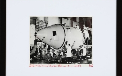NOT SOLD. A b/w Soviet press photograph showing the construction of a rocket head for...