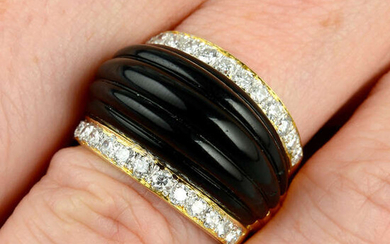 A carved onyx and diamond dress ring.
