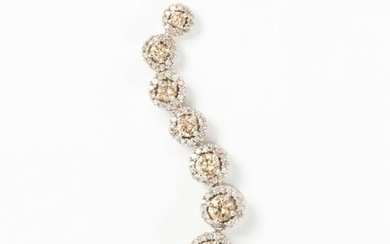 A champagne diamond and ten karat white gold pendant