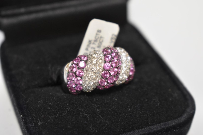 A diamond and pink sapphire white gold ring, stamped 750, se...