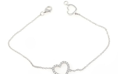A diamond bracelet with a heart-shaped pendant set with numerous brilliant-cut diamonds...