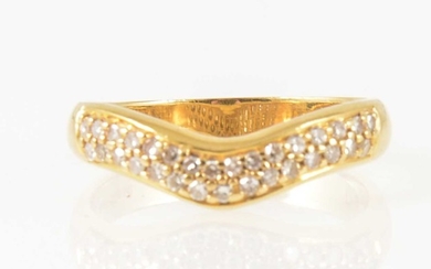 A diamond set wishbone ring.