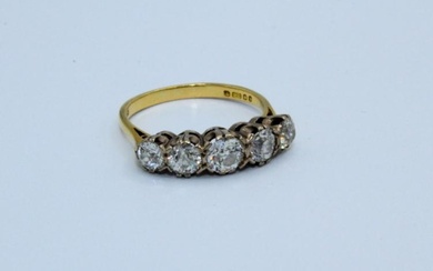 A five stone diamond ring set with five graduated round...