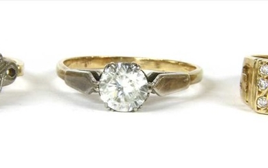 A gold single stone cubic zirconia ring