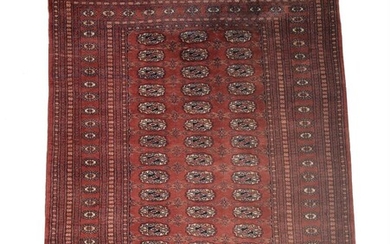 A group of three rugs in Bokhara style