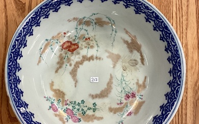 A large Chinese bowl decorated with buildings. Signed to base.