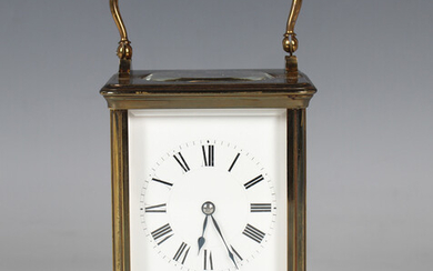 A late 19th century brass carriage timepiece by Henri Jacot, with eight day movement, the enamelled