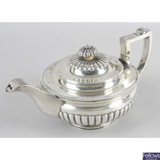 A late George III silver teapot.
