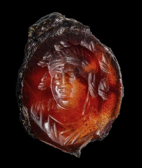 A late hellenistic agate intaglio. Bust of a Bacchus....