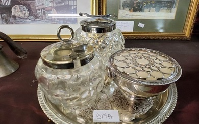 A metal tray with cut glass lidded jars and a Viners silver ...