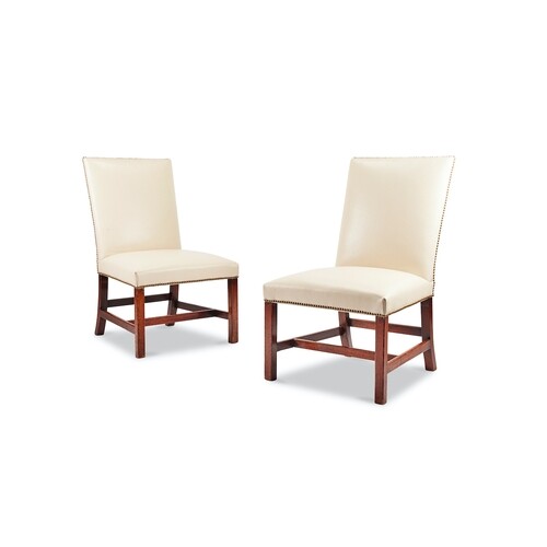 A pair of George III mahogany side chairs Upholstered and cl...