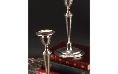 A pair of George V silver navette shaped candlesticks, taper...