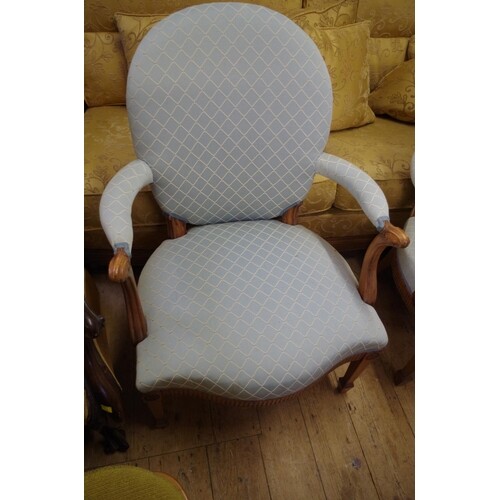 A pair of Georgian style mahogany and upholstered elbow chai...