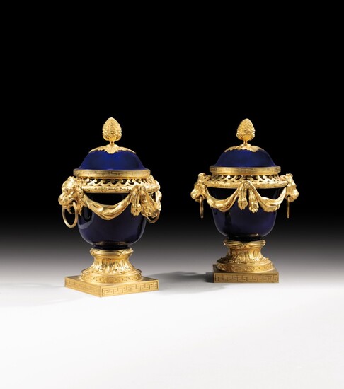 A pair of Louis XVI style gilt-bronze mounted Sèvres porcelain pot-pourri vases, after a model by Jean Dulac, late 19th century