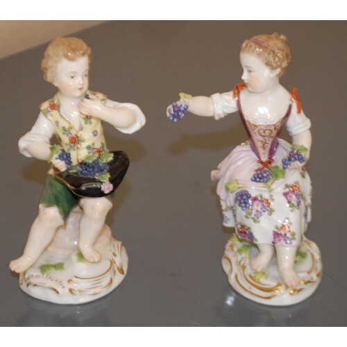 A pair of Meissen figures, of a girl and a boy, both bare fo...