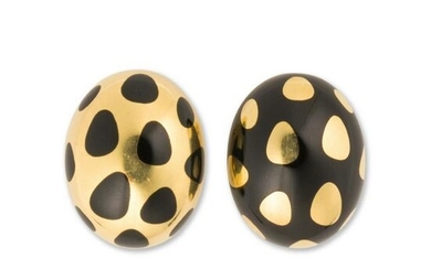A pair of black jade and eighteen karat gold earrings